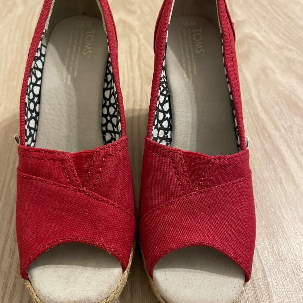 Toms women’s red platform heels.